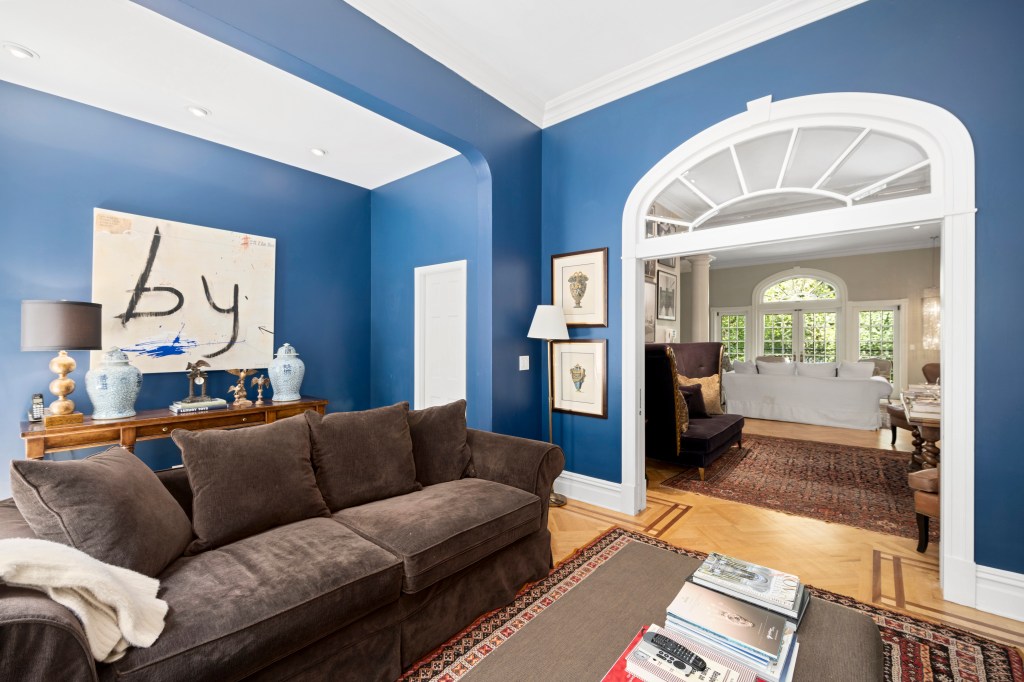 A stately doorway leads to a cozy living area.