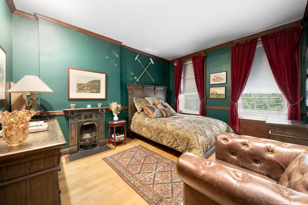 One of the bedrooms, this one with a stunning jewel-tone wall color.