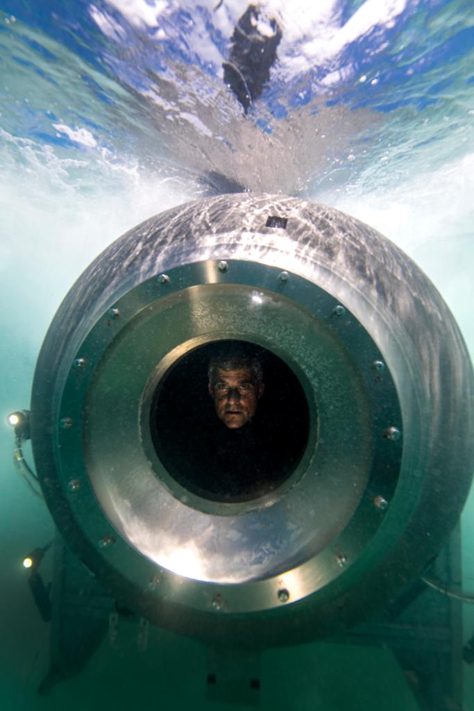 CEO of OceanGate Stockton Rush peering out of the porthole on the Titan submersible.