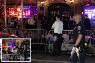 Police are seen in front of the Stonewall Inn where a person was slashed Monday, June 26, 2023.