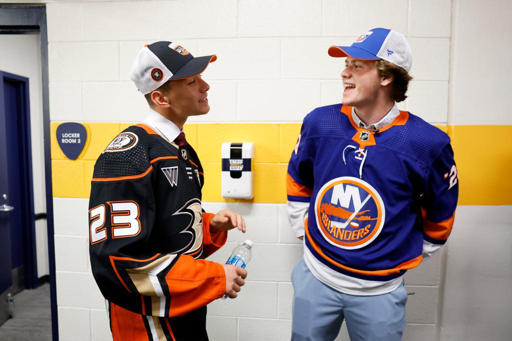 Islanders draft pick Danny Nelson talks with Ducks pick Carey Terrance at the 2023 NHL Draft.