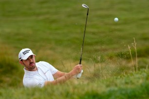 Patrick Cantlay hits a shot out of the bunker during a U.S. Open practice round on June 13.