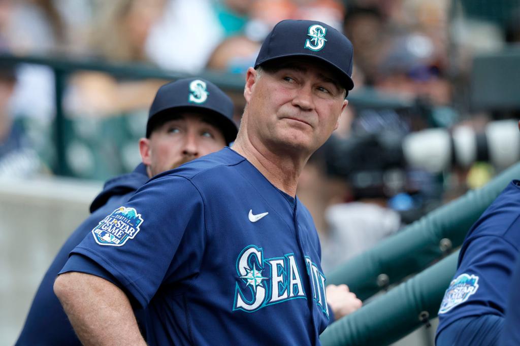 Manager Scott Servais #9 of the Seattle Mariners looks around the dugout during the eighth inning of a game against the Detroit Tigers at Comerica Park on May 13, 2023 in Detroit, Michigan. 
