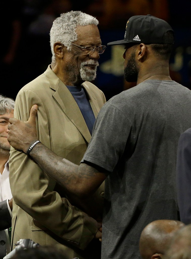 Bill Russell, left, greets Cleveland Cavaliers forward LeBron James after Game 7 of basketball's NBA Finals between the Golden State Warriors and the Cavaliers in Oakland, Calif., Sunday, June 19, 2016.
