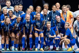 United States players including Alex Morgan (#13) celebrate with the trophy during the SheBelieves Cup womens soccer match between the United States and Brazil on February 22, 2023 at Toyota Stadium in Frisco, Texas.