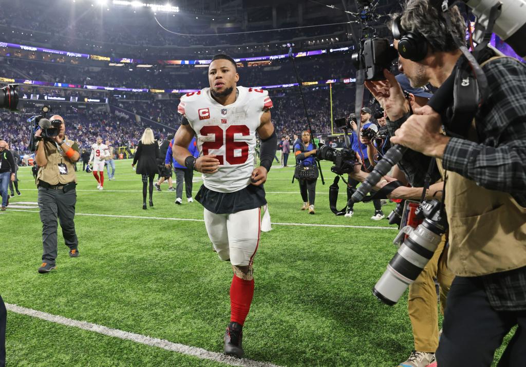 Saquon Barkley #26 of the New York Giants reacts as he walks off the field