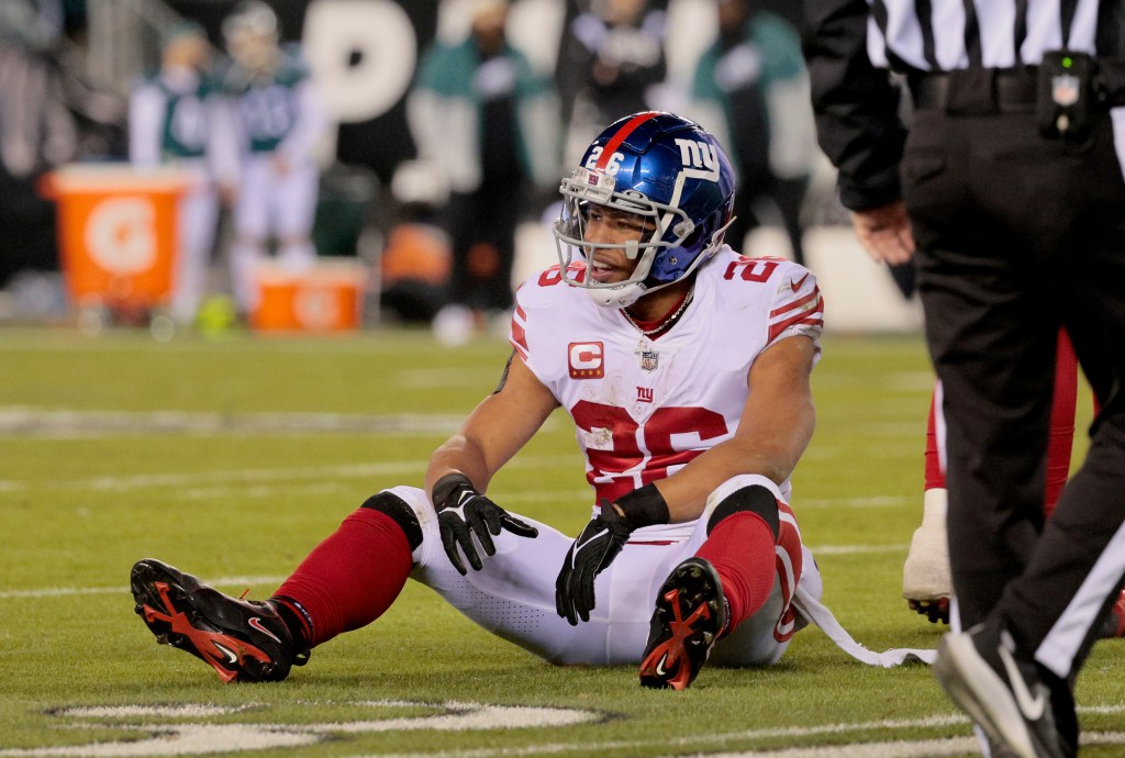 Giants running back Saquon Barkley #26 is all smiles after he runs the ball during the third quarter.