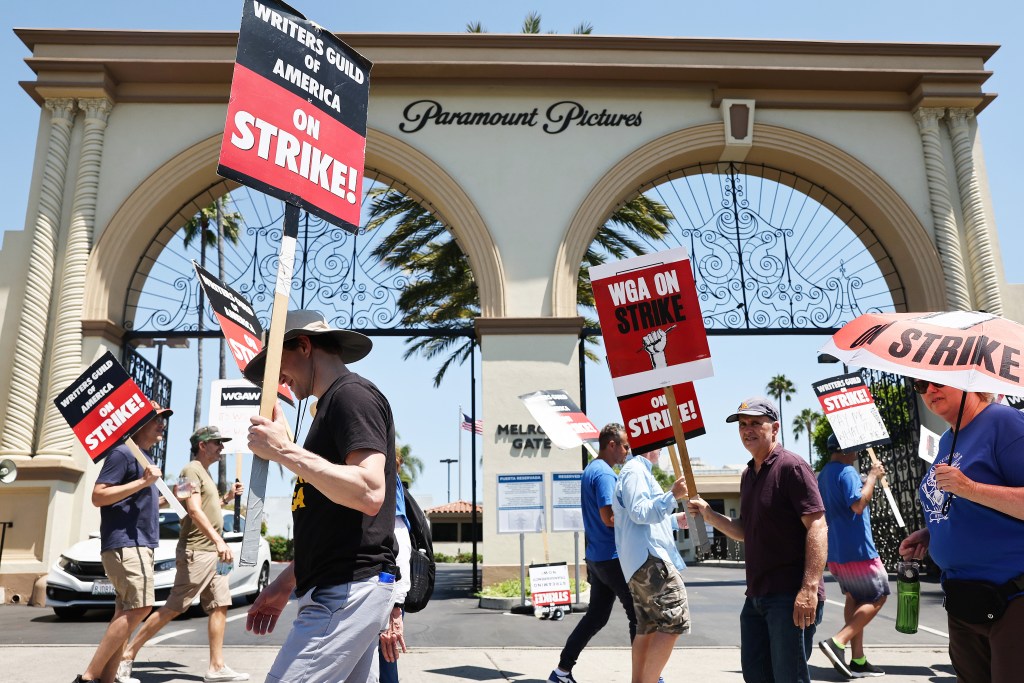 Striking WGA (Writers Guild of America) workers picket outside Paramount Studios on July 12, 2023 in Los Angeles, California.