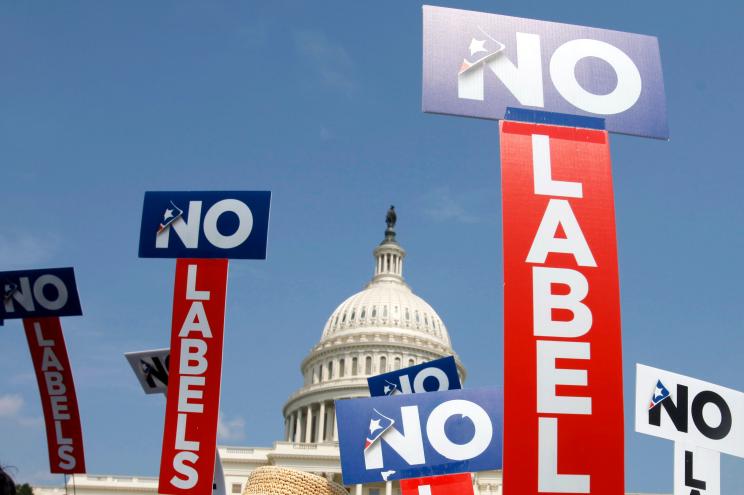 No Labels posters held in front of the Capitol Building