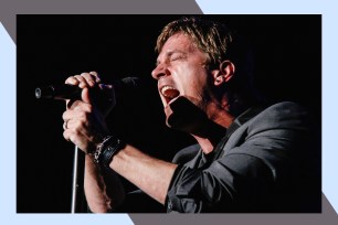 Rob Thomas gives his all while singing onstage.