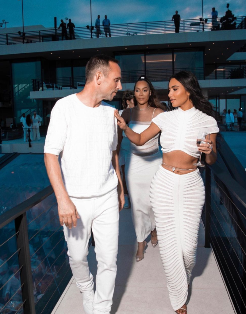 Fanatics CEO Michael Rubin dispelled rumors that Tom Brady and Kim Kardashian were flirting at his white party, saying they are just friends.
