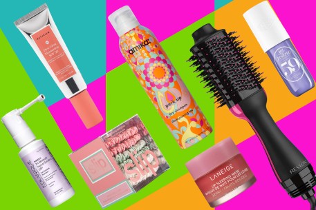 A variety of beauty products on a multicolored background.
