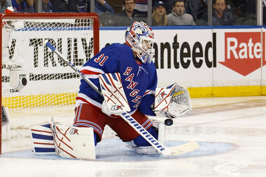 Igor Shesterkin #31 of the New York Rangers makes a save during the over time as the New Jersey Devils defeat the New York Rangers 2-1 in Game 3 of the Eastern Conference First Round of the NHL Stanley Cup Playoffs at Madison Square Garden on April 22, 2023. 