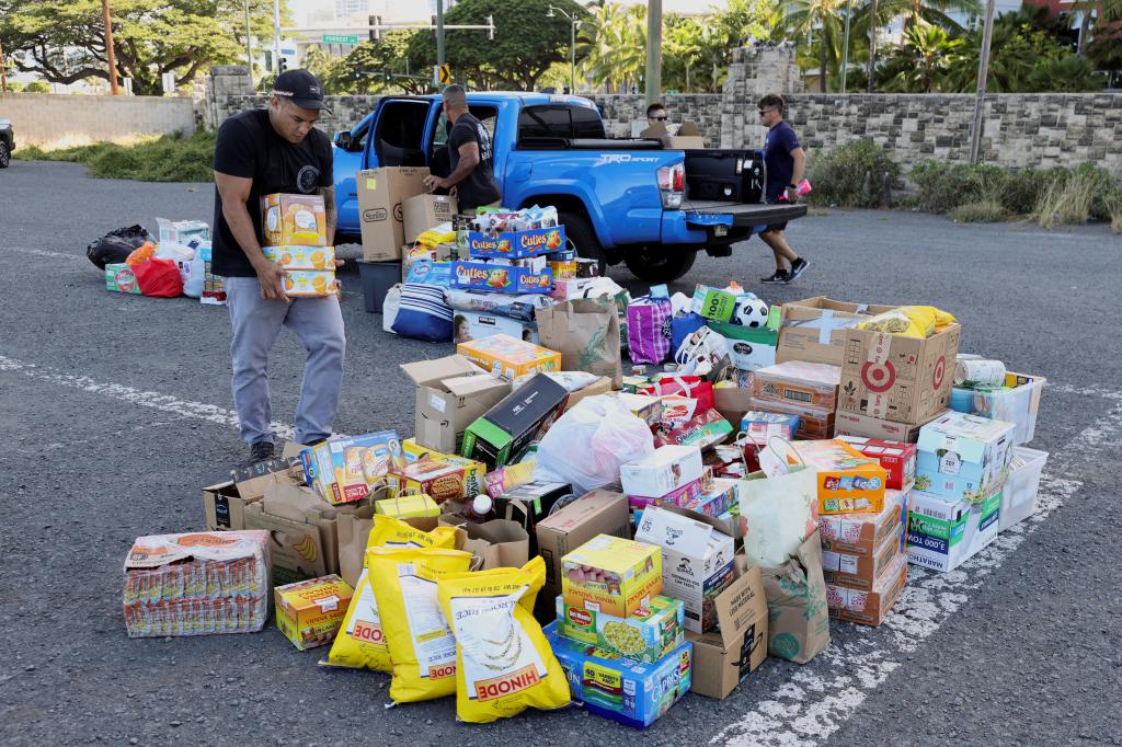 Hawaii stevedores collect donations for the victims of the Maui wildfires at Pier 1, where they will ship them to Maui next week, in Honolulu, Hawaii, U.S. August 12, 2023.