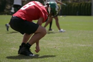 Aaron Rodgers detailed his habit of picking blades of grass from the field to help with gauging the wind direction or strengthening his grip during Episode 2 of "Hard Knocks".