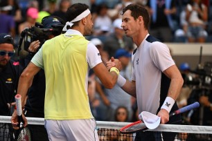 Andy Murray (right) congratulates Grigor Dimitrov after his second-round loss at the U.S. Open.