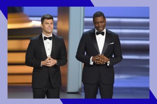 Colin Jost (L) and Michael Che perform at the Emmys together.
