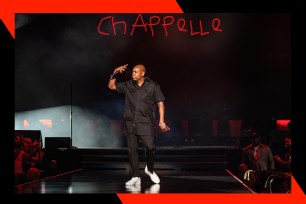 Dave Chappelle walks onstage at New York City's Madison Square Garden.