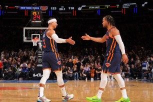 Josh Hart #3 and Jalen Brunson #11 of the New York Knicks high five during the game against the Utah Jazz on February 11, 2023 at Madison Square Garden in New York City, New York. 