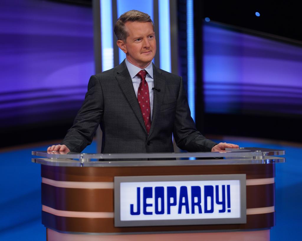 Ken Jennings stands at the "Jeopardy!" podium.