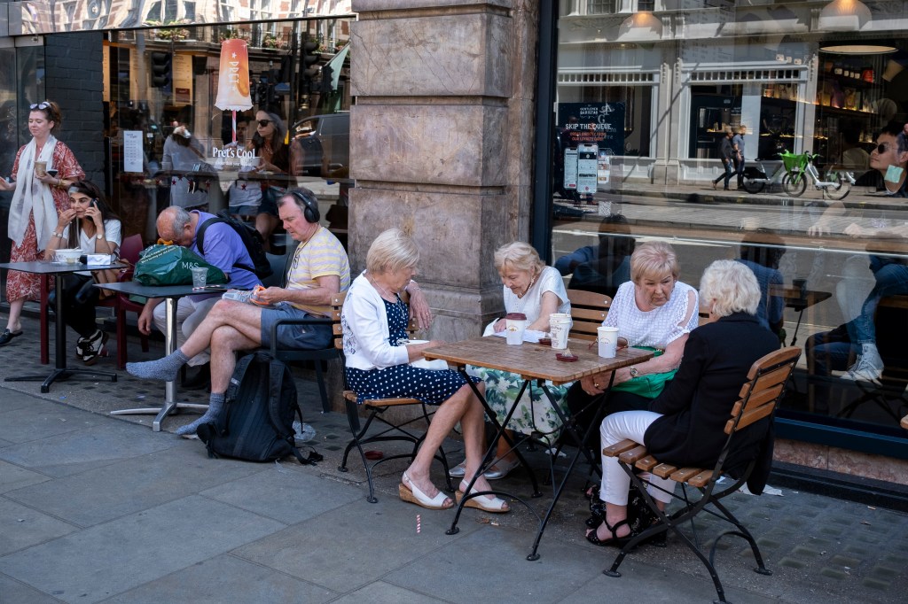 senior women chatting at a cafe