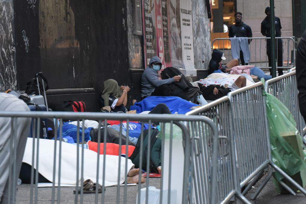 Migrants sleeping in front of the Roosevelt Hotel. 