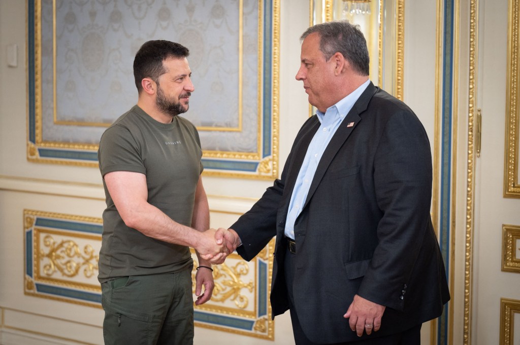 Chris Christie and Volodymyr Zelensky are pictured shaking hands