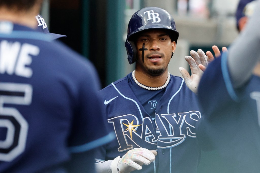 Wander Franco in the dugout while wearing a helmet.