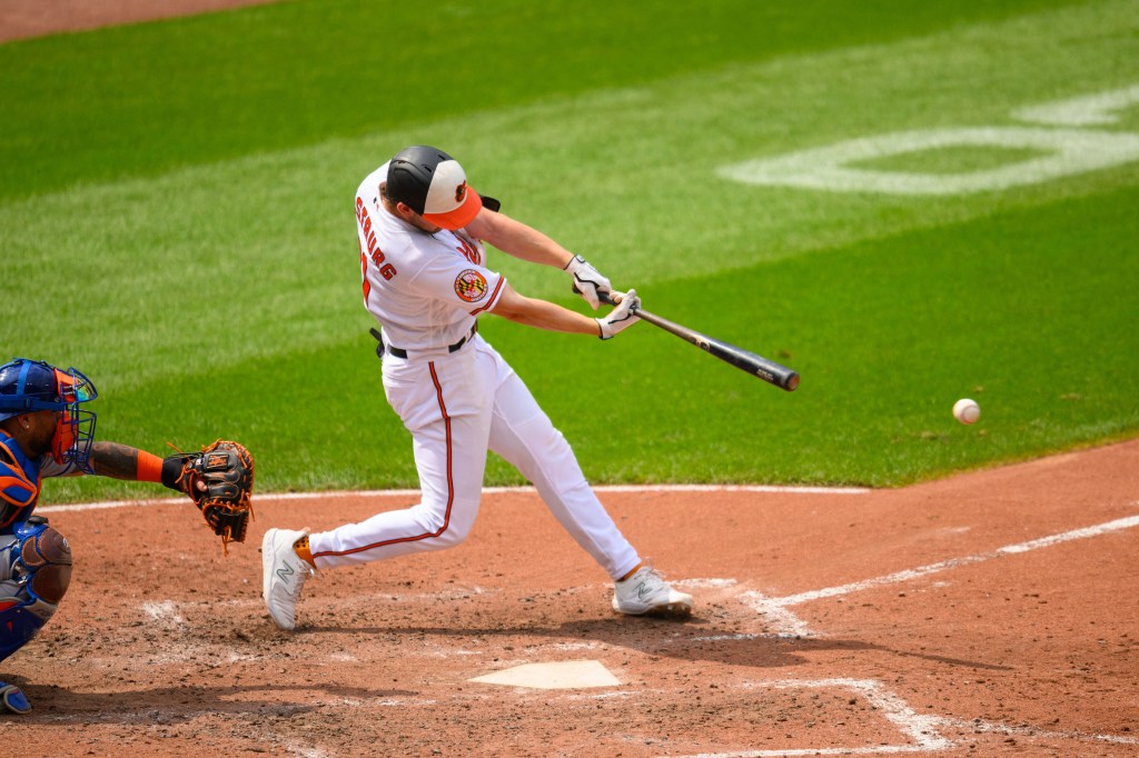 Baltimore Orioles second baseman Jordan Westburg (11) hits a single during the sixth inning against the New York Mets.