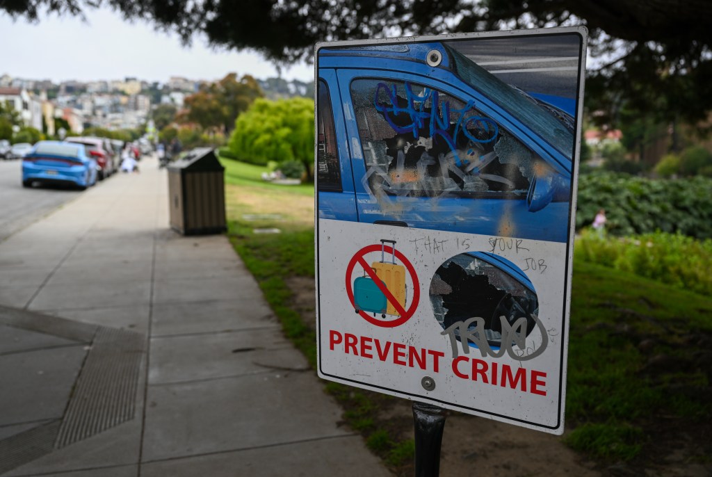 FILEâSAN FRANCISCO, CA - AUGUST 9: A safety alert sign that says ''Prevent Crime'' is seen near the Palace of Fine Arts as Car break-ins have been at epidemic levels in San Francisco, California, United States on August 9, 2023. 