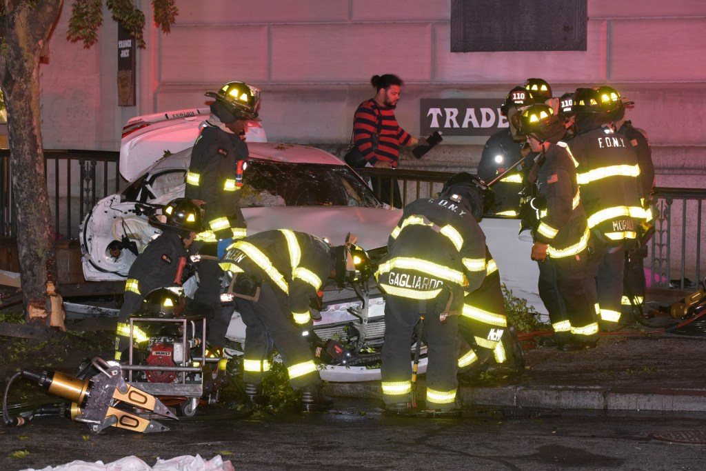 FDNY firefighters are seen at the scene of the crash at Atlantic Avenue and Court Street.
