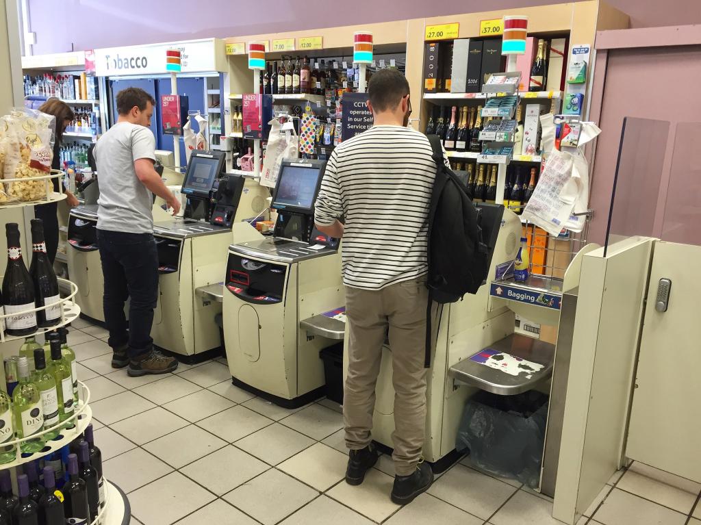 Shoppers using self service checkouts