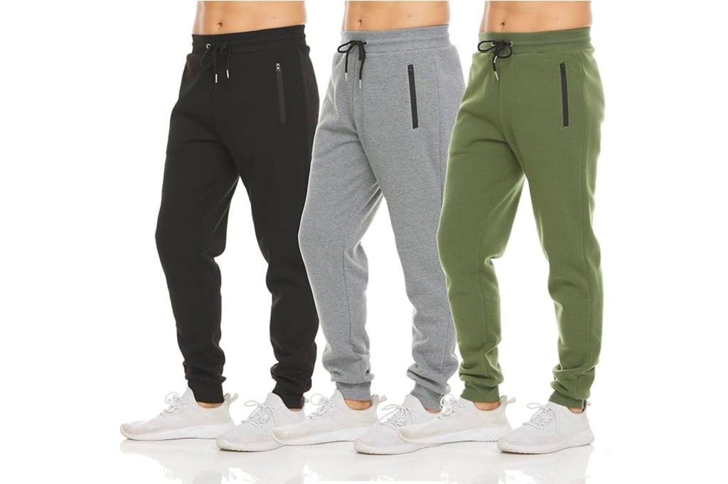 Three models in sweatpants of different colors.