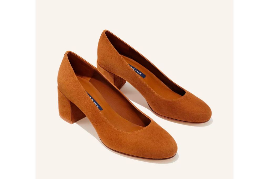 A pair of brown suede heels