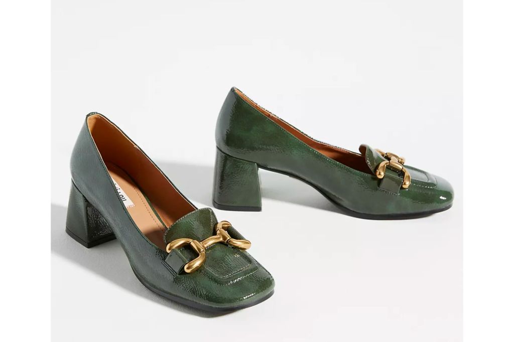 A pair of green patent leather high heel loafers