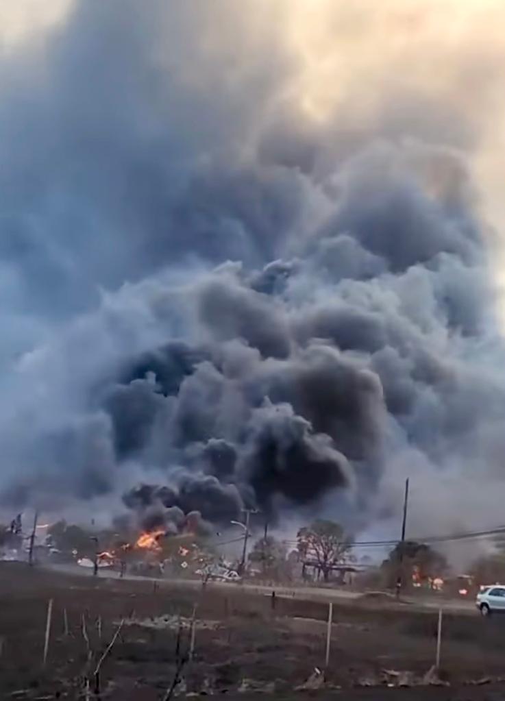 Footage shows a huge plume of smoke as flames engulf multiple houses in Lahaina.