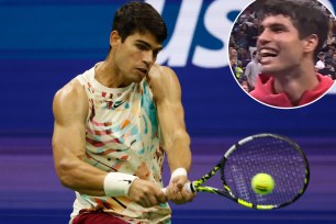 Carlos Alcaraz, hitting a backhand during his first-round win at the U.S. Open, also belted out a tune at the end of the match (inset).