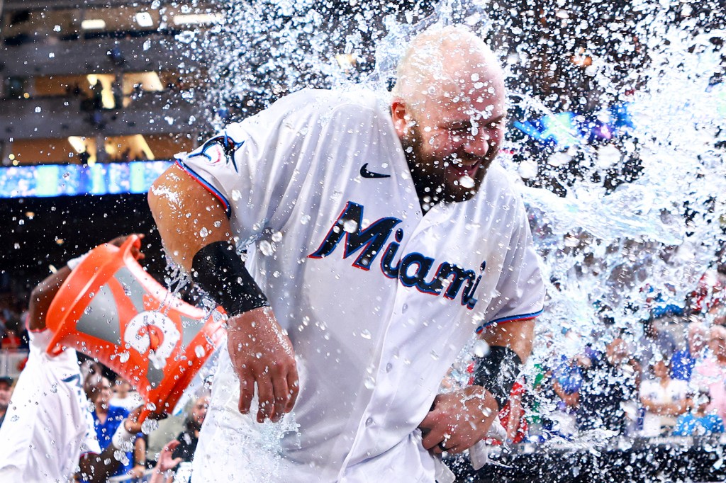 Jake Burger #36 of the Miami Marlins receives a gatorade bath after hitting a walk-off RBI single to defeat the New York Yankees