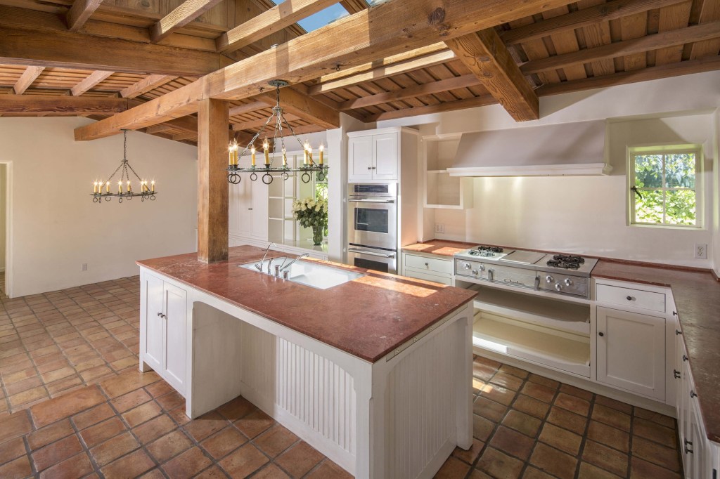 The kitchen still boasts many of the original features, but a skylight was built in over the years.