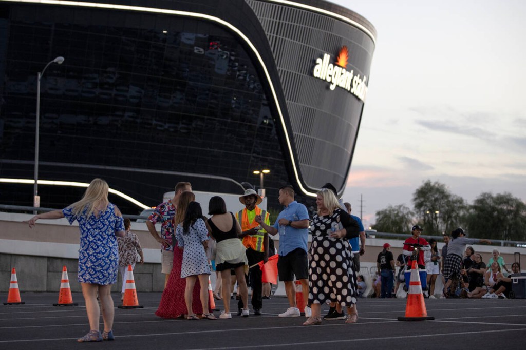 Concert-goers wait for ride shares near Allegiant Stadium after Ed Sheehan canceled his concert on Saturday, Sept. 9, 2023, in Las Vegas. 