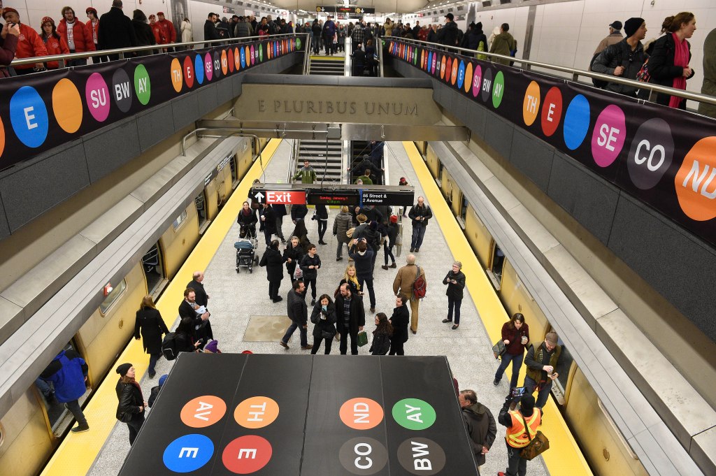 Straphangers gawk inside a Second Avenue Subway station