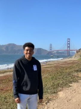 Yohanes Kidane smiles with the Golden Gate Bridge in the background