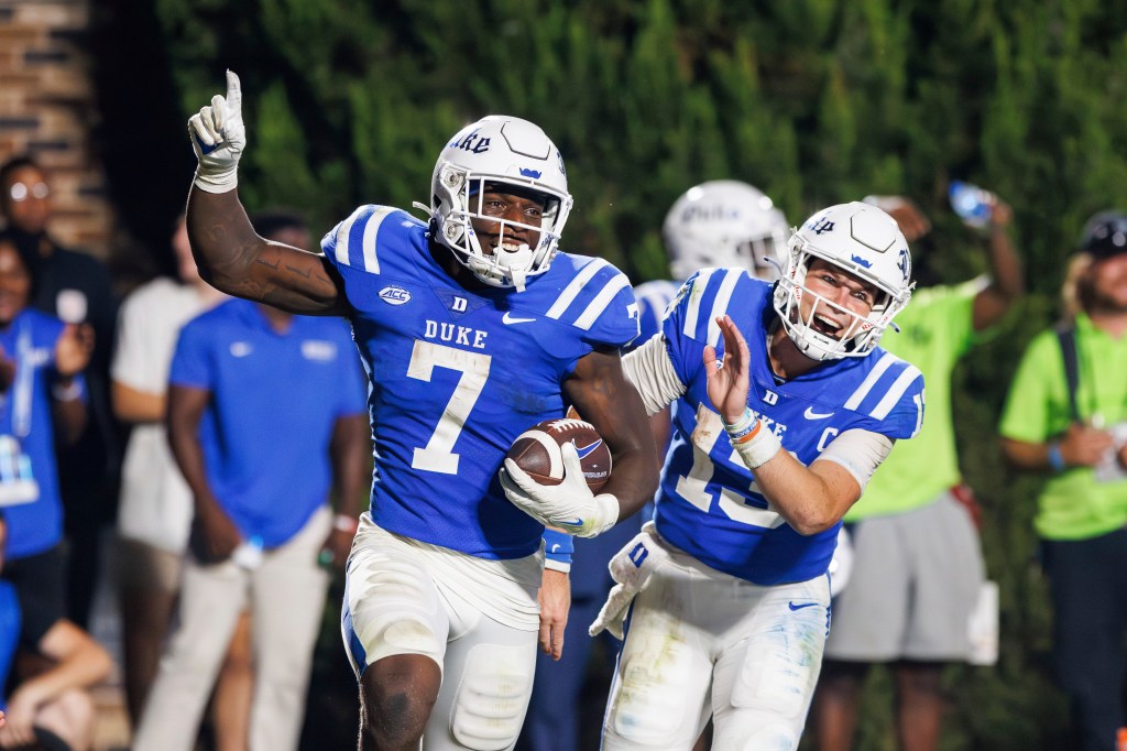 Jordan Waters and Riley Leonard celebrate a touchdown.