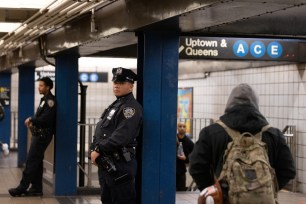 Officers patrol inside an A and C subway station in Manhattan.