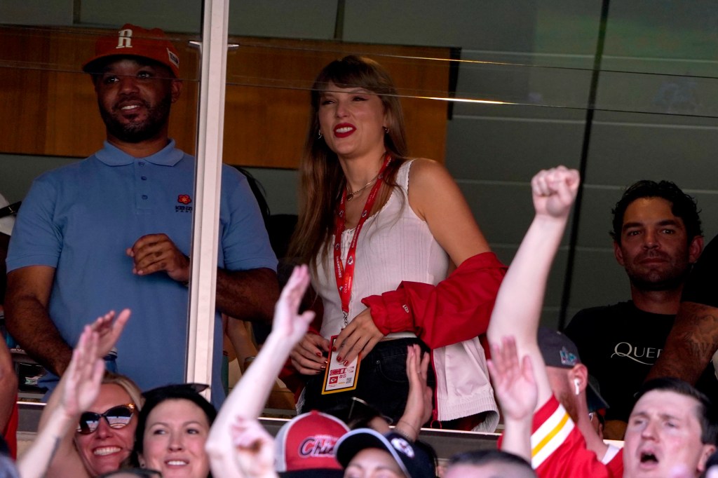 Taylor Swift watches from a suite inside Arrowhead Stadium.