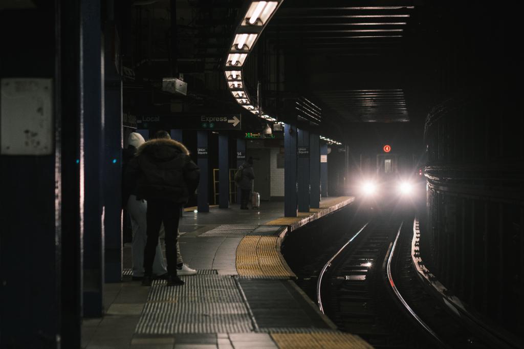 January 17, 2022 - New York, NY: Commuters wait for a 6 train at Union Square.