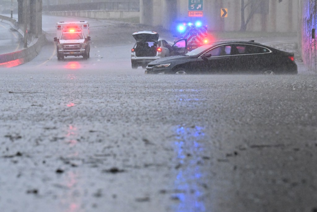 Multiple people on the highway became trapped inside their vehicles with the water up to the vehicles windows.