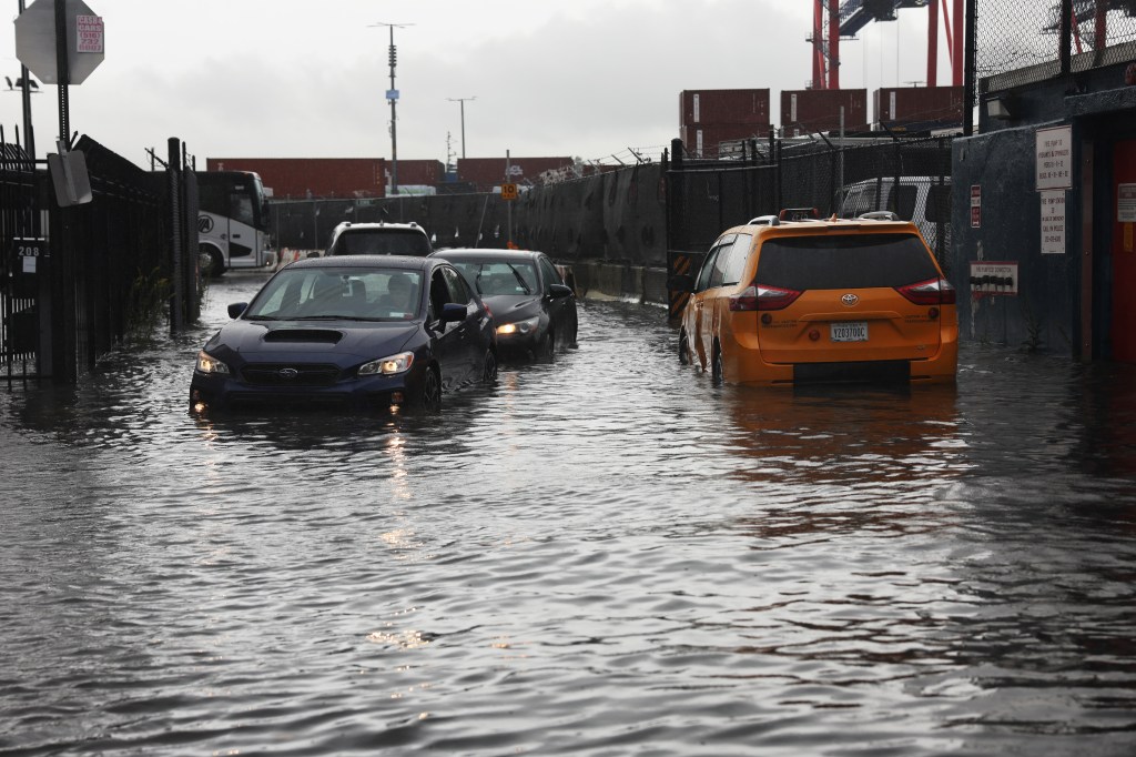 Several cars sit stuck in the flooded streets in the Red Hook neighborhood in Brooklyn, New York.