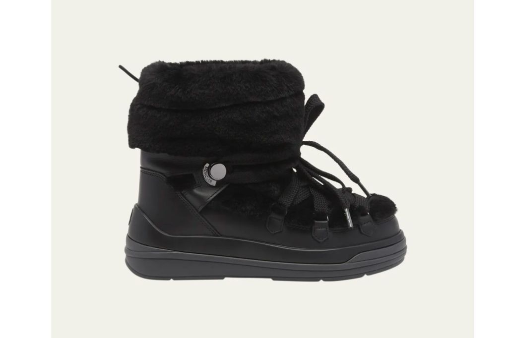 A designer snow boot in the color black.