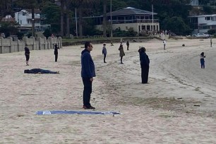 A photo of a group mediation session on a beach near Sydney, Australia has left people online puzzled.